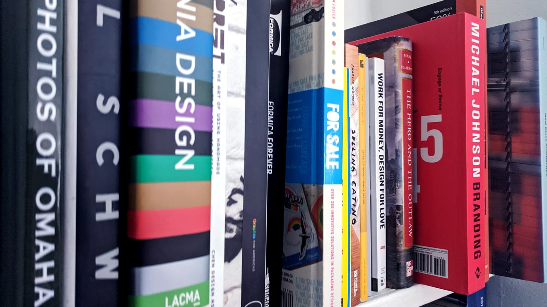 Folk design studio bookshelf with books.